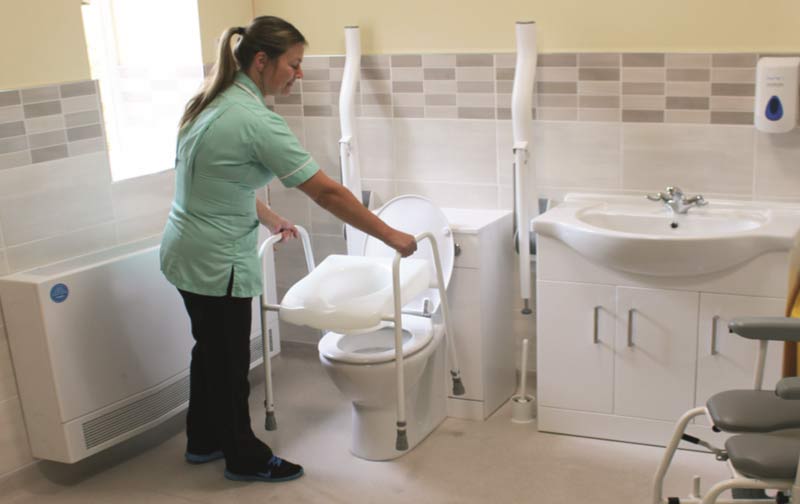 carer-in-bathroom-toilet2 carer toilet stand in wet room bathroom