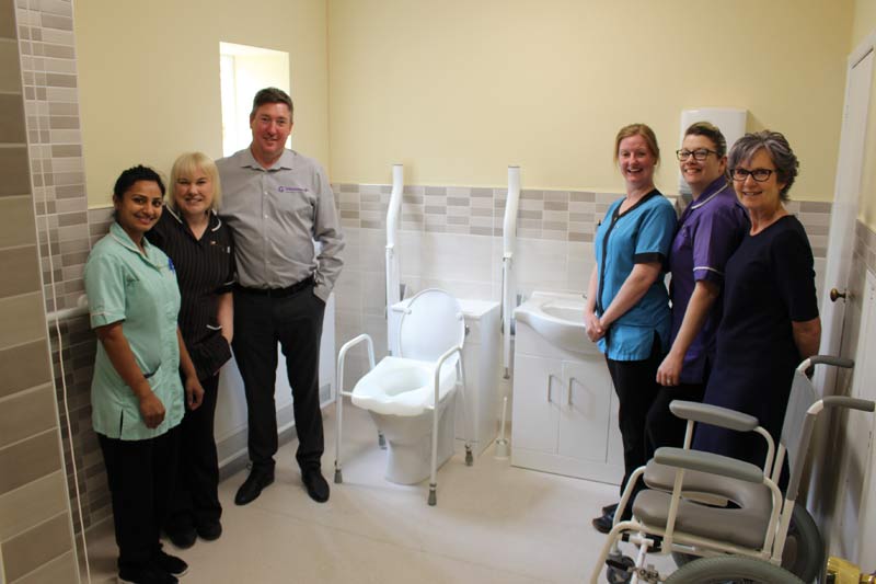 hollybank-house-team-bathroom Hollybank house staff in assistive bathroom with toilet