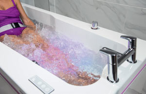 womans legs in bath with jacuzzi on
