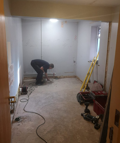 man building a shower wet room